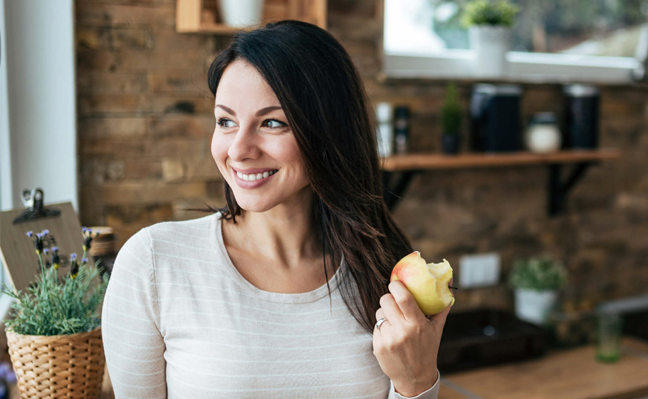 woman eating well after getting dental filling in carrollton tx